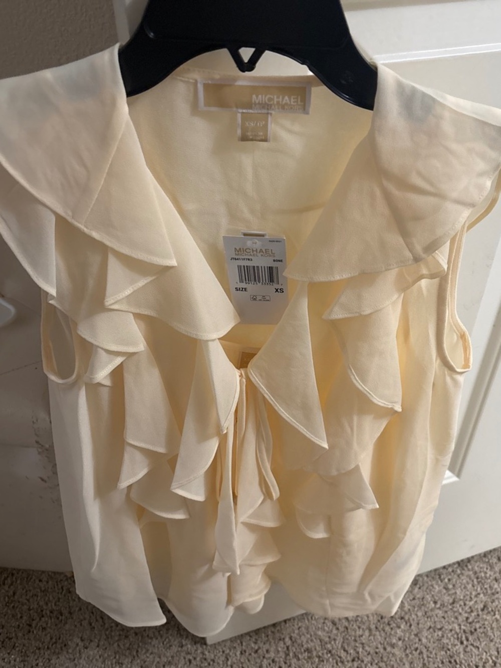 Michael Kors sleeveless blouse New with the tags size extra small